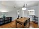 Open-concept dining area with wood floors connects to another room at 2025 Sylvester Rd # P4, Lakeland, FL 33803