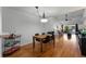 Open-concept dining area with wood floors connects to living room and kitchen at 2025 Sylvester Rd # P4, Lakeland, FL 33803