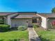 Charming home featuring manicured lawn, garden, and a well-maintained exterior at 2025 Sylvester Rd # P4, Lakeland, FL 33803