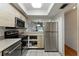 Bright kitchen boasts stainless steel appliances and light wood cabinets at 2025 Sylvester Rd # P4, Lakeland, FL 33803