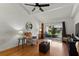 Bright living room featuring wood floors, vaulted ceiling, comfortable seating, and sliding glass doors to outdoor area at 2025 Sylvester Rd # P4, Lakeland, FL 33803