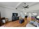 Spacious living room featuring wood floors, vaulted ceiling, comfortable seating, and dining area at 2025 Sylvester Rd # P4, Lakeland, FL 33803