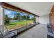 Relaxing screened-in patio offering serene backyard views and comfortable seating at 2025 Sylvester Rd # P4, Lakeland, FL 33803