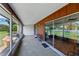 Inviting screened patio with outdoor seating, a clear view of the serene backyard, and sliding glass doors at 2025 Sylvester Rd # P4, Lakeland, FL 33803