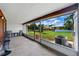 Enclosed patio with chairs overlooking well-maintained grounds and a manicured lawn at 2025 Sylvester Rd # P4, Lakeland, FL 33803