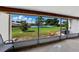 Enclosed patio with lawn view and seating, providing peaceful outdoor living at 2025 Sylvester Rd # P4, Lakeland, FL 33803