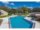 Aerial view of a community pool with ample seating, pristine blue water, and beautifully landscaped surroundings at 2025 Sylvester Rd # P4, Lakeland, FL 33803