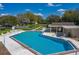 Aerial view of the community pool featuring clear blue water, plenty of lounge seating, and well-maintained grounds at 2025 Sylvester Rd # P4, Lakeland, FL 33803