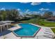 Aerial view of community pool with a unique shape, plenty of seating, and views of the lush community surroundings at 2025 Sylvester Rd # P4, Lakeland, FL 33803