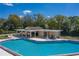 Aerial view of the community pool with a covered lounge area and plenty of seating, perfect for relaxing and socializing at 2025 Sylvester Rd # P4, Lakeland, FL 33803