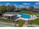 Aerial view of a community pool, nearby shuffleboard courts, and covered outdoor seating area at 2025 Sylvester Rd # P4, Lakeland, FL 33803
