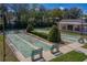 Aerial view of the shuffleboard courts showcasing the neat landscaping, benches, and surrounding trees at 2025 Sylvester Rd # P4, Lakeland, FL 33803