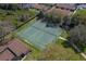 Aerial shot of neighborhood tennis courts near residences and natural landscape at 2025 Sylvester Rd # P4, Lakeland, FL 33803