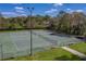 Community tennis courts surrounded by lush greenery for active lifestyles at 2025 Sylvester Rd # P4, Lakeland, FL 33803