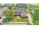 Charming home with a manicured lawn, mature trees, and close proximity to a community pool at 2025 Viewpoint Landings Rd, Lakeland, FL 33810