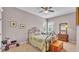 Charming bedroom showcases a decorative iron bed frame and a serene ambiance with soft lighting at 2025 Viewpoint Landings Rd, Lakeland, FL 33810