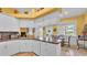Well-appointed kitchen with white cabinets, breakfast nook, and tile floors at 2025 Viewpoint Landings Rd, Lakeland, FL 33810