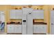 Bright kitchen with modern white appliances, white cabinets and ample storage at 2025 Viewpoint Landings Rd, Lakeland, FL 33810