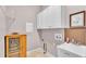 Functional laundry room equipped with cabinet storage and a utility sink at 2025 Viewpoint Landings Rd, Lakeland, FL 33810