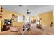 Inviting living room with tile and carpet flooring, ceiling fan, and open layout at 2025 Viewpoint Landings Rd, Lakeland, FL 33810