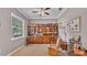 Cozy living room with built-in shelving, neutral walls, and natural light from the window at 2025 Viewpoint Landings Rd, Lakeland, FL 33810