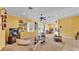 Bright living room featuring large windows, a ceiling fan, and comfortable seating at 2025 Viewpoint Landings Rd, Lakeland, FL 33810