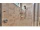 Detail shot of the tiled shower with dual shower heads and corner shelves, offering a spa-like experience at 2025 Viewpoint Landings Rd, Lakeland, FL 33810