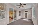 Sunroom boasting carpet floors and sliding glass doors, offering a tranquil indoor-outdoor experience at 2025 Viewpoint Landings Rd, Lakeland, FL 33810