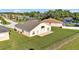 Wide backyard with green grass, patio, and privacy fence, perfect for entertaining or enjoying outdoor living at 2255 Couples Dr, Lakeland, FL 33813