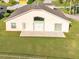 Spacious backyard featuring a patio, green lawn, and privacy fence. Great for outdoor activities and relaxation at 2255 Couples Dr, Lakeland, FL 33813