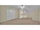 Spacious bedroom featuring neutral carpet, a ceiling fan and a closet at 2255 Couples Dr, Lakeland, FL 33813