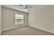 Bedroom featuring carpet flooring, a ceiling fan and a window with blinds for natural light at 2255 Couples Dr, Lakeland, FL 33813