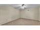 Spacious bedroom featuring neutral carpet, a ceiling fan and natural light at 2255 Couples Dr, Lakeland, FL 33813