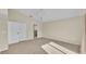 Bedroom features a vaulted ceiling, carpet, ceiling fan, and closet with access to an ensuite bathroom at 2255 Couples Dr, Lakeland, FL 33813