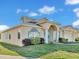 Inviting home front with fresh landscaping, vibrant green grass, and elegant architectural accents, perfect for families at 2255 Couples Dr, Lakeland, FL 33813