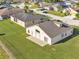 Well-maintained house showcasing a spacious yard, clean driveway, and a welcoming curb appeal at 2255 Couples Dr, Lakeland, FL 33813