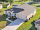 Charming exterior featuring a manicured lawn, beautiful landscaping, and attached garage, enhancing curb appeal at 2255 Couples Dr, Lakeland, FL 33813