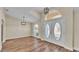 Bright entryway with wood laminate flooring, updated fixtures, and stylish double doors at 2255 Couples Dr, Lakeland, FL 33813