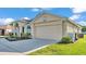 Charming single-story home with a manicured lawn and a two car garage at 2255 Couples Dr, Lakeland, FL 33813