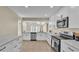 Updated kitchen featuring white cabinets, stainless steel appliances, and quartz countertops at 2255 Couples Dr, Lakeland, FL 33813