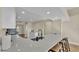 Bright kitchen with white cabinetry, quartz countertops, and bar seating area at 2255 Couples Dr, Lakeland, FL 33813