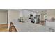 Bright kitchen featuring a large quartz countertop island with seating and modern stainless steel appliances at 2255 Couples Dr, Lakeland, FL 33813