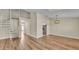 Bright living space with wood laminate flooring, spiral staircase, and contemporary lighting fixtures at 2255 Couples Dr, Lakeland, FL 33813