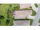 Aerial view of home showcasing the backyard, tile roof, and surrounding neighborhood at 2425 Laurel Glen Dr, Lakeland, FL 33803