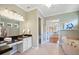 Bathroom features dual vanity, soaking tub, walk-in closet and neutral color palette at 2425 Laurel Glen Dr, Lakeland, FL 33803