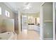 An open bathroom with a soaking tub, shower stall, dual sinks, and vanity at 2425 Laurel Glen Dr, Lakeland, FL 33803