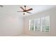 Bedroom with ample natural light, ceiling fan and neutral color palette at 2425 Laurel Glen Dr, Lakeland, FL 33803