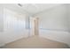 Cozy bedroom featuring a double door closet, carpeted floor and neutral-colored walls at 2425 Laurel Glen Dr, Lakeland, FL 33803