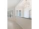 Welcoming foyer with tiled floors, decorative chandelier, and a view into the living spaces at 2425 Laurel Glen Dr, Lakeland, FL 33803