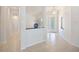 Spacious foyer with tiled floors, decorative chandelier, and view into the living areas at 2425 Laurel Glen Dr, Lakeland, FL 33803